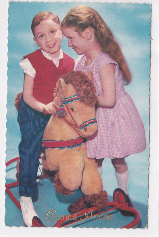 CARTE POSTALE CPSM FANTAISIE BONNE ANNEE ENFANTS CHEVAL A ROULETTES